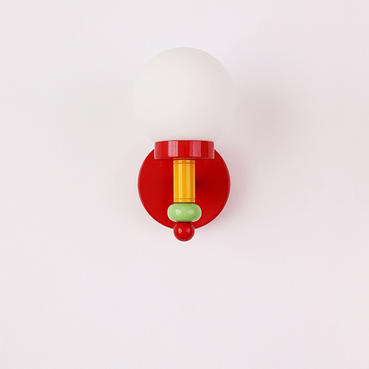 Red wall lamp with green accent and white globe