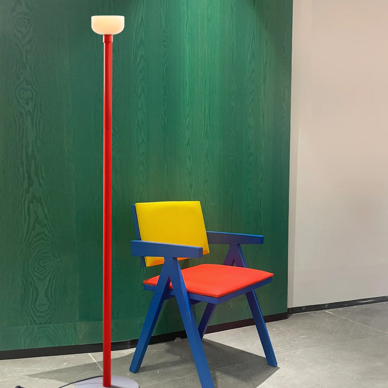 Red floor lamp with a pale shade