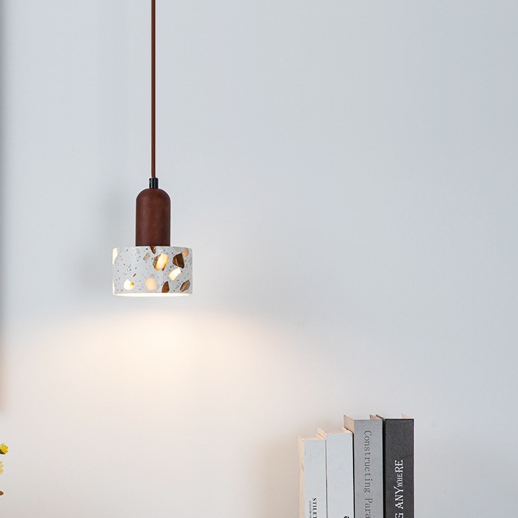 Pendant light with brown mount and patterned glass