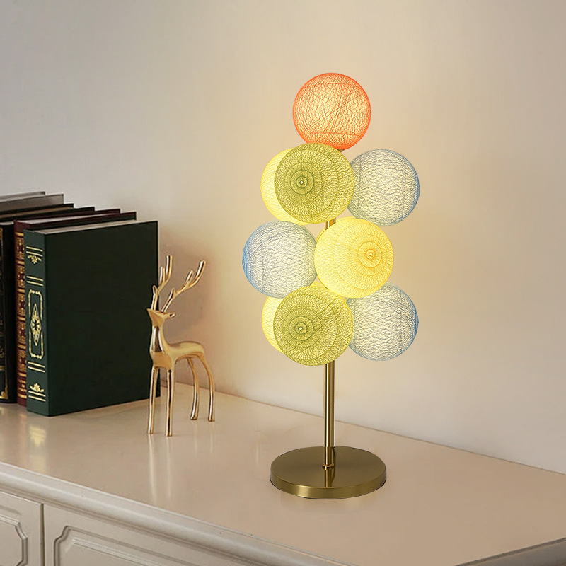 Table lamp with multicoloured round glass shades